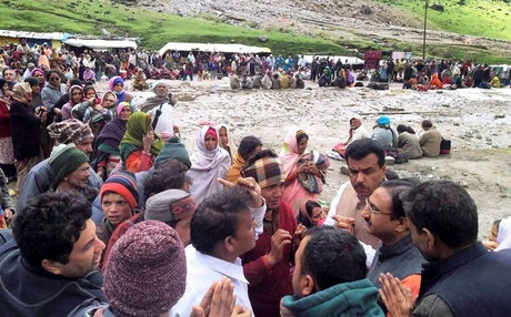  Former Uttarakhand Chief Minister Ramesh Pokhariyal interacting with pilgrims near flood-hit Kedarnath shrine in Rudraprayag on Thursday.