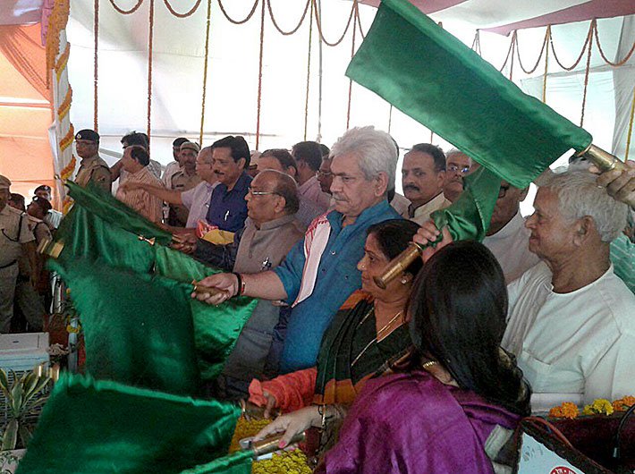 Manoj Sinha, minister of state for railways, flagging off the train
