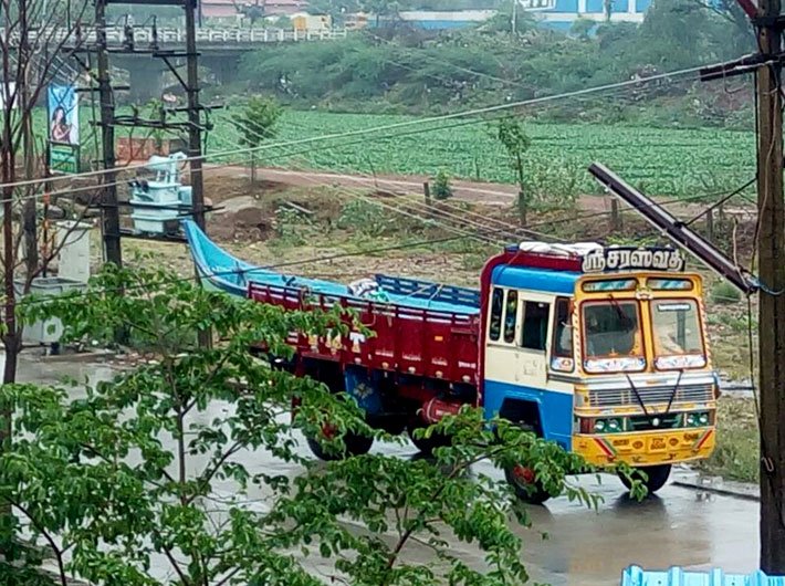 Boat being brought on a truck to be stationed in Manapakkam locality 