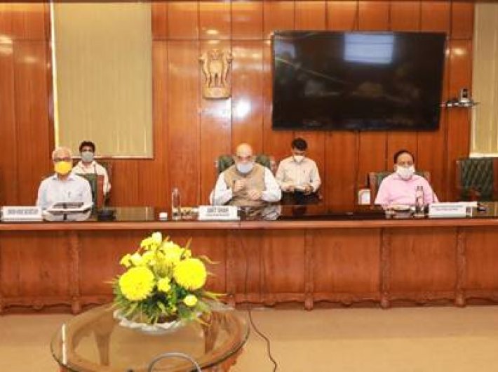 Home minister Amit Shah and others at the meeting to review the capital`s Covid-19 situation Sunday.