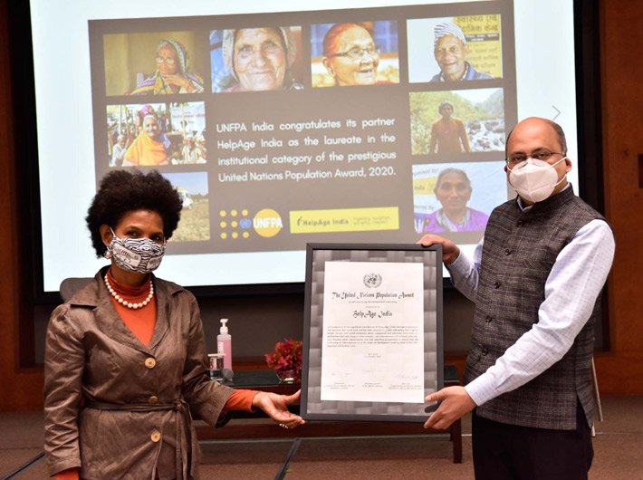 Argentina Matavel Piccin, Representative India, UNFPA, presents the UN Population Award certificate to Rohit Prasad, CEO, HelpAge India