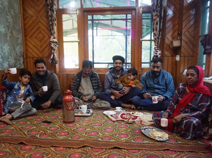 Javed and Khadija sharing food with the Ahmed family (Photo courtesty: Javed Sheikh)