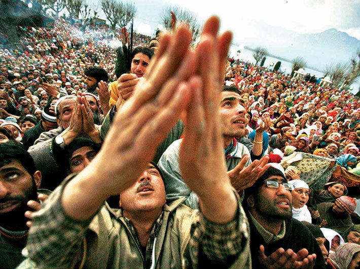 People go into raptures as they get a glimpse of the relic at the Hazratbal shrine