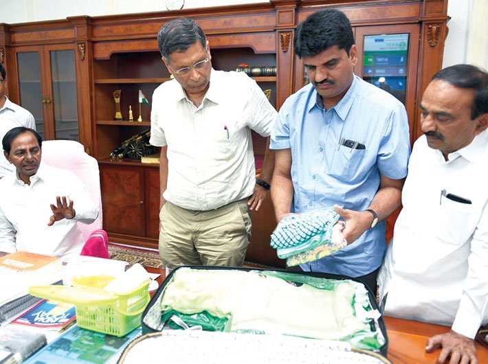 Chief minister KCR and GoI’s economic advisor Arvind Subramanian take a look at a sample kit (Photo: Twitter/KCR)