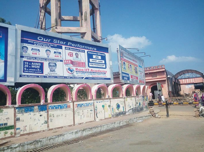  Coaching institutes put up their hoardings on the boundary wall of Kota station