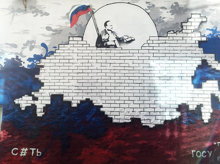 A wall graffiti near the Sevastopol naval base showing Putin fortifying Crimea brick by brick 