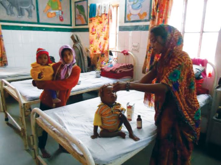 Enlivened with bright pictures of Donald Duck, a very grey elephant and a bright green parrot, the malnutrition treatment centre room at the Shahabad hospital has several babies being attended to by their mothers.