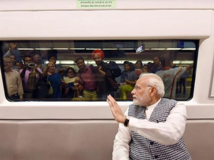 Prime minister Narendra Modi travelling by Delhi Metro in 2018.