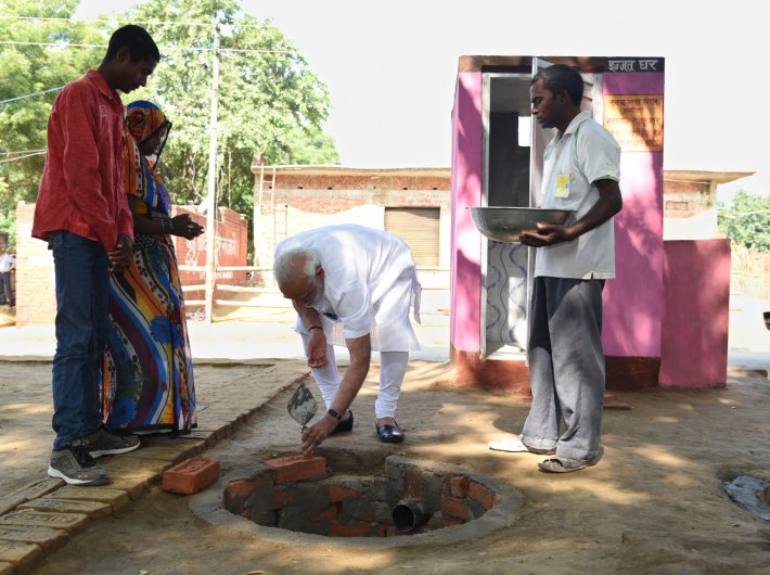 PM performing shramdan for the construction of a twin pit toilet in Varanasi on Saturday