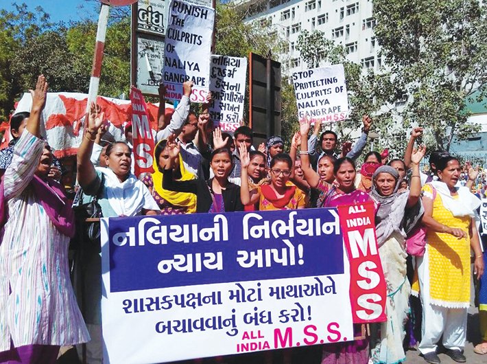 Members of women organisations protest in Ahmedabad for a fair probe in the Naliya case 