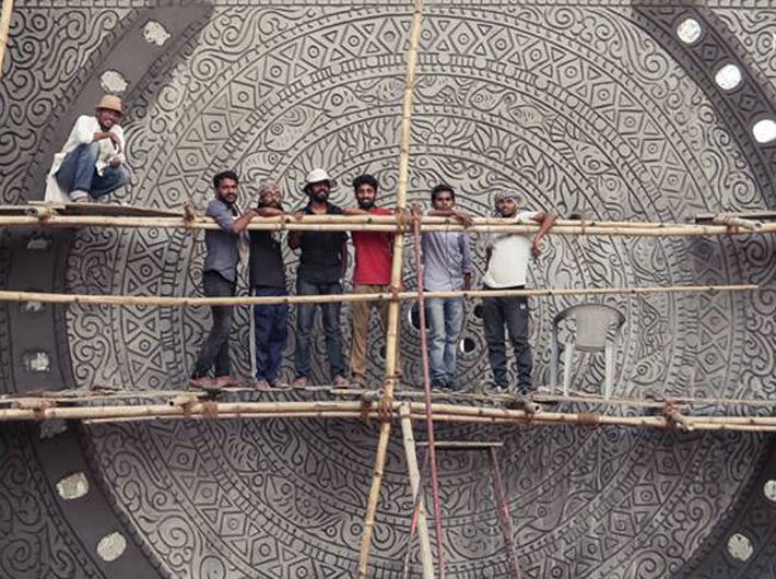 Suresh Nair and his team working on a mural in Varanasi