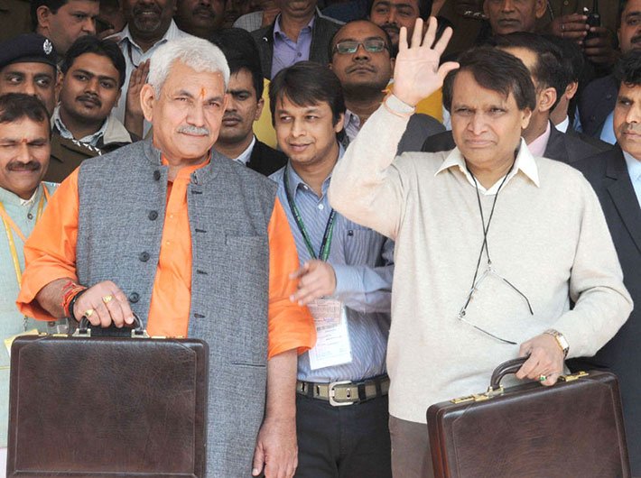Union minister for railways, Suresh Prabhu, and minister of state for railways, Manoj Sinha, leaving Rail Bhawan for Parliament House to present the Railway Budget 2016-17. 