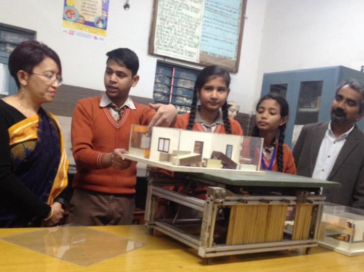 Students demonstrate the importance of fixing down loose elements in a building, with Sangita Ghalay of Honeywell India and Dr Anshu Sharma of SEEDS (GN Photo)