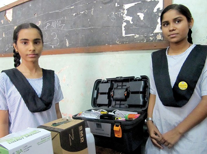 Bushra (right) with her mobile phone repairing kit. (Photos: Geetanjali Minhas)