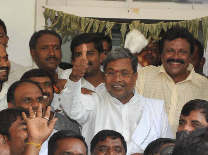 The thumb’s up: Siddaramaiah flashes the victory sign after becoming the Karnataka chief minister in Bangalore on May 10.