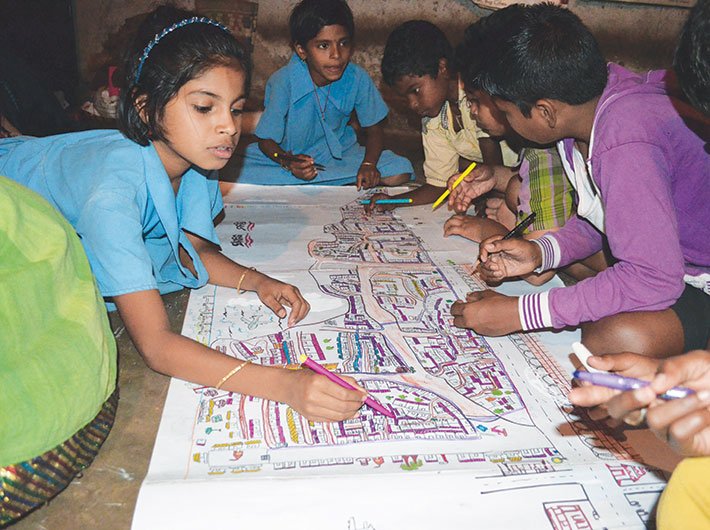 Armed with colour pens and crayons, the children have created maps of their slums