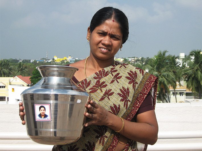 Vaani showing her steel water container with Jayalalithaa`s picture on it.