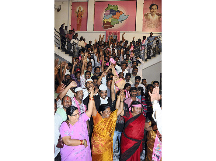 TRS workers in Hyderabad celebrate Congress working committee`s decision to bifurcate Andhra Pradesh and create a separate Telangana state on Tuesday. 