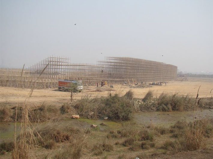 Construction work in progress at the Yamuna bed