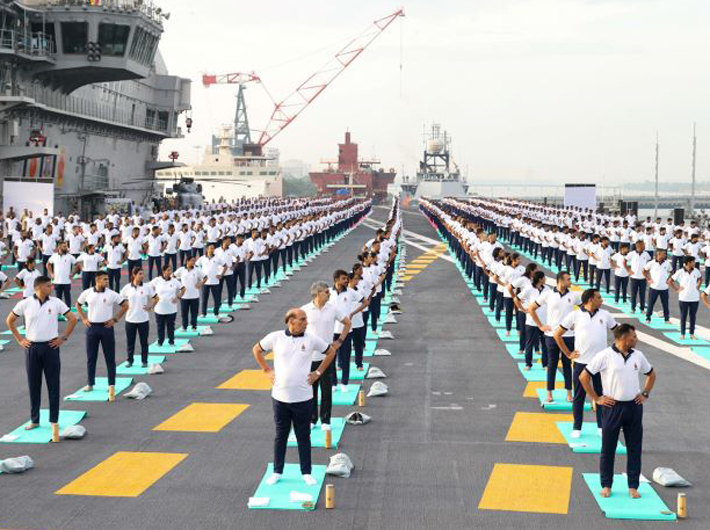 Defence minister Rajnath Singh performs Yoga with the personnel of the Armed Forces and the Indian Coast Guard onboard INS Vikrant on the occasion of 9th International Day of Yoga on June 21, 2023. The Chief of the Naval Staff Admiral R Hari Kumar is also seen.