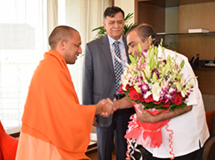 Uttar Pradesh CM with Mukesh Ambani of the Reliance group